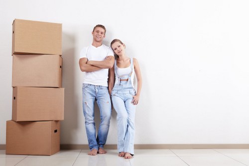 Furniture removal team handling a sofa move in Wimbledon