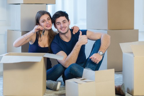 Flat removals planning in Wimbledon with moving boxes and a removals van