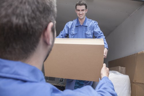 Team preparing moving equipment before a safe removal job