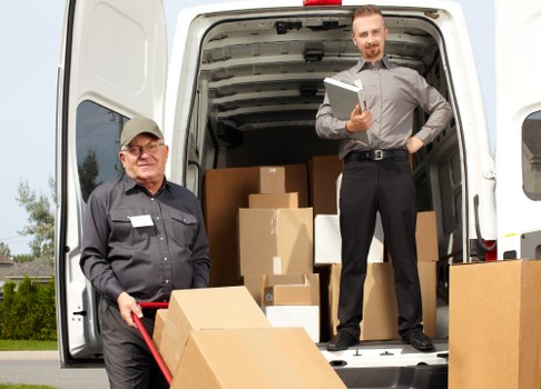 Office relocation planning in Wimbledon with moving boxes and desks