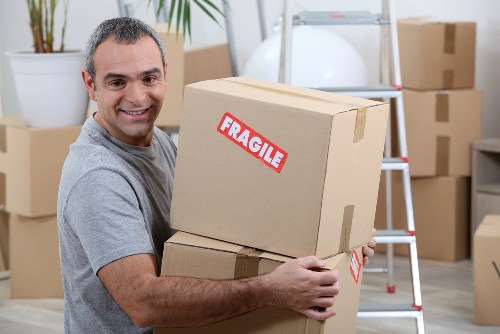 Bulky furniture being safely loaded during Wimbledon pick-up