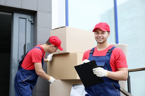 Trained movers handling belongings with care during a Wimbledon move