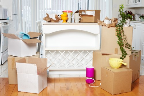 Removal team planning a house move in Wimbledon with boxes and furniture