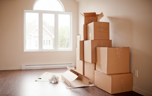 Packed moving boxes and furniture ready for collection in Wimbledon