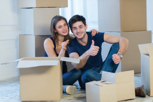 Professional movers loading furniture for same day removal service