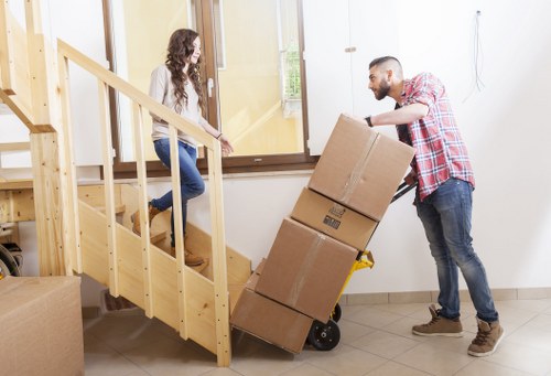 Mover handling furniture carefully during a man and van service