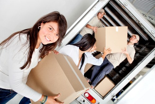 Professional movers loading furniture for a Wimbledon relocation