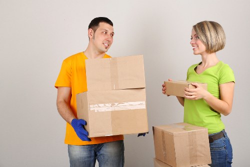 Trained movers handling items safely in a Wimbledon removal job